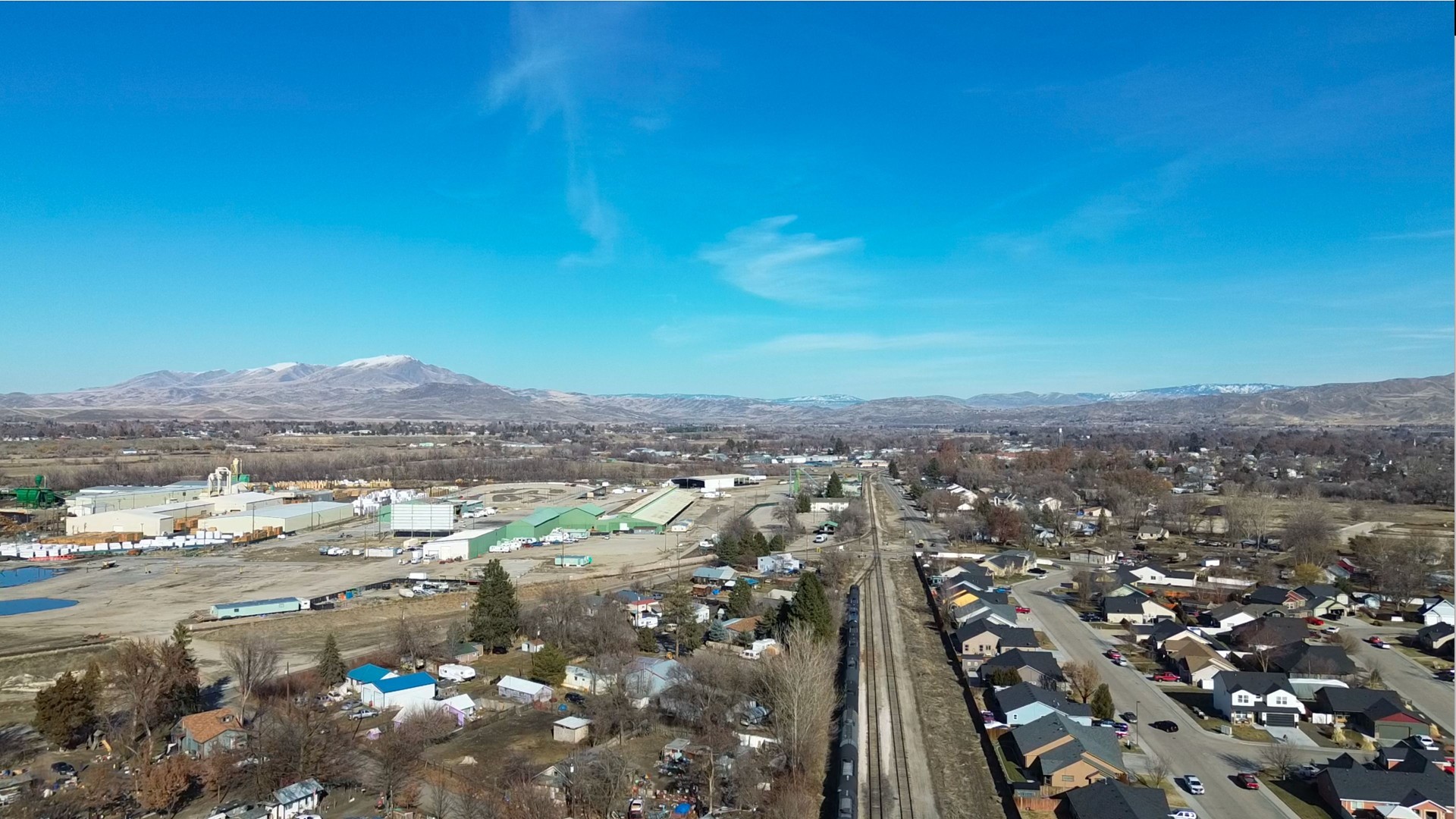 Aerial view of Emmett, Idaho, looking south along the railroad tracks to the left of Main Street
